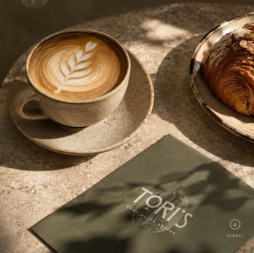 A latte and pastry at Tori's Speciality Coffee